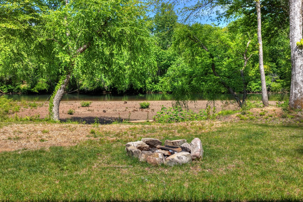 Lot 5 Grassy Creek Road Copperhill, TN 37317 - Photo 12 of 30 a backyard of a house with lots of green space
