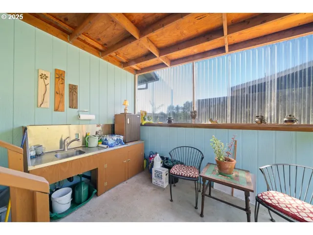 a outdoor living space with furniture and umbrella