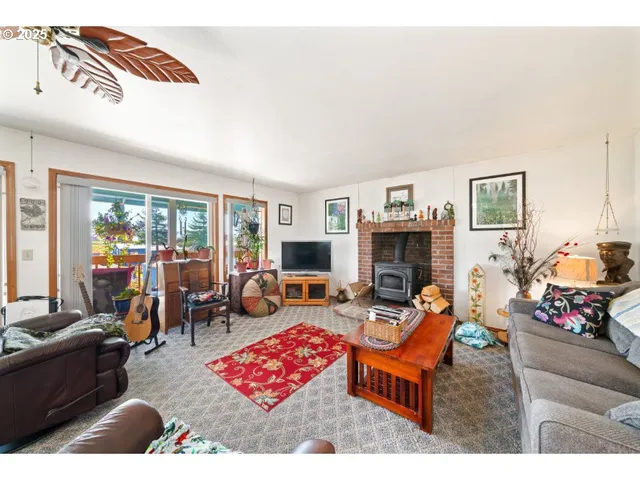 a living room with furniture fireplace and flat screen tv