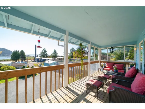 a view of a patio with wooden floor