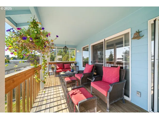 a outdoor living space with furniture and flowers