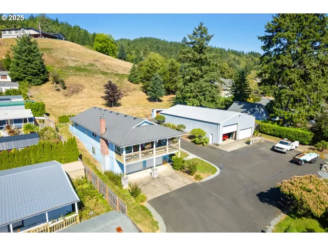 an aerial view of residential houses with outdoor space