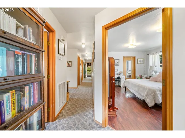 a view of a bedroom from a corridor