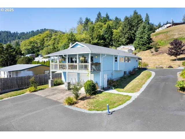 a view of a house with a backyard and a swimming pool