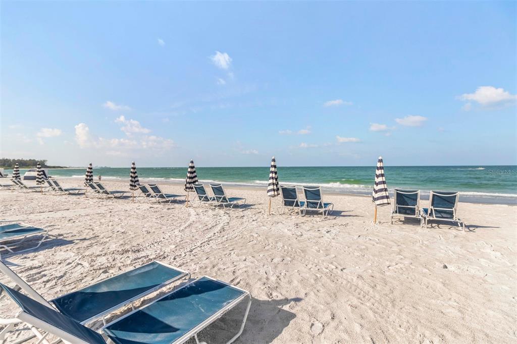 240 Sands Point Road, Unit 4104 Longboat Key, FL 34228 - Photo 36 of 47 a view of a swimming pool with a lounge chair