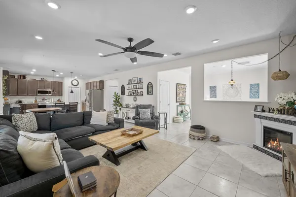 a living room with furniture and a fireplace