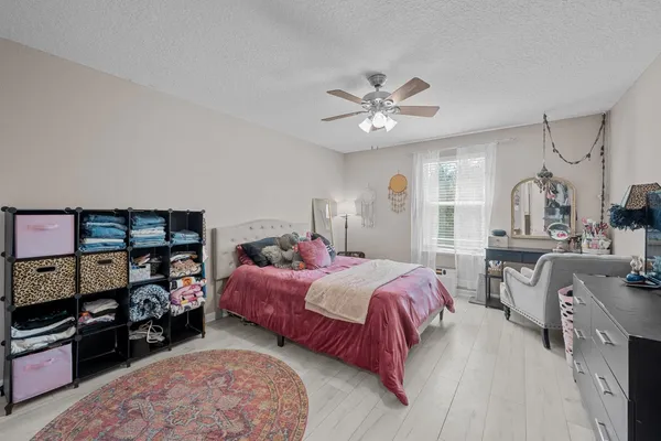 a bedroom with a bed furniture and a window