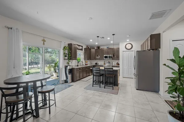a kitchen with a table and chairs in it