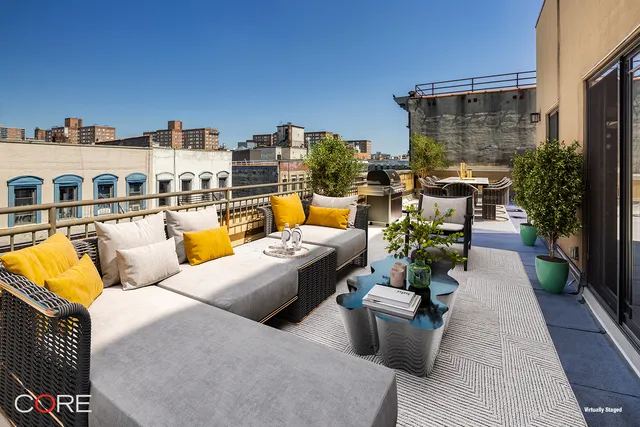 a view of swimming pool with outdoor seating couches and potted plants