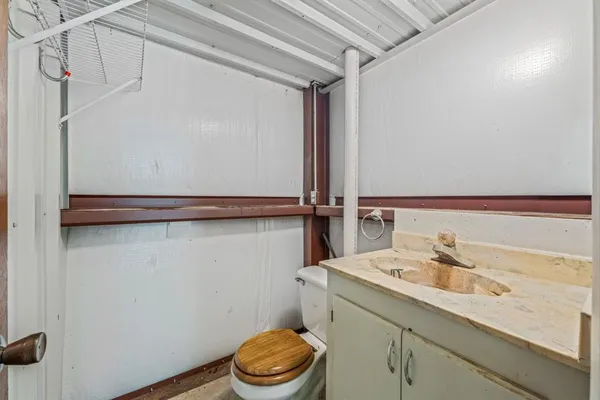 a picture of a bathroom with a shower