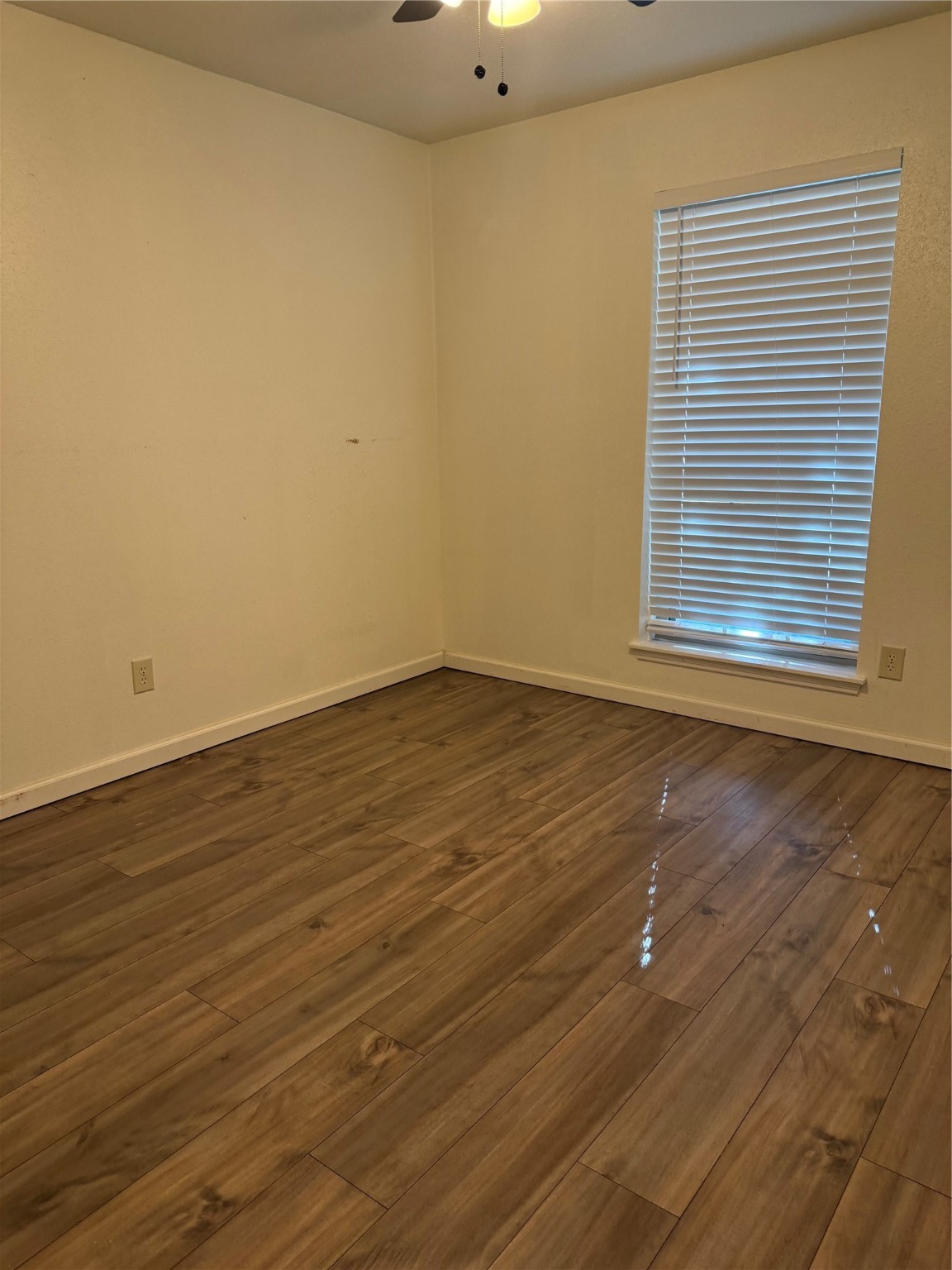 3210 Haydee Road Spring, TX 77388 - Photo 7 of 12 a view of a room with wooden floor and a window
