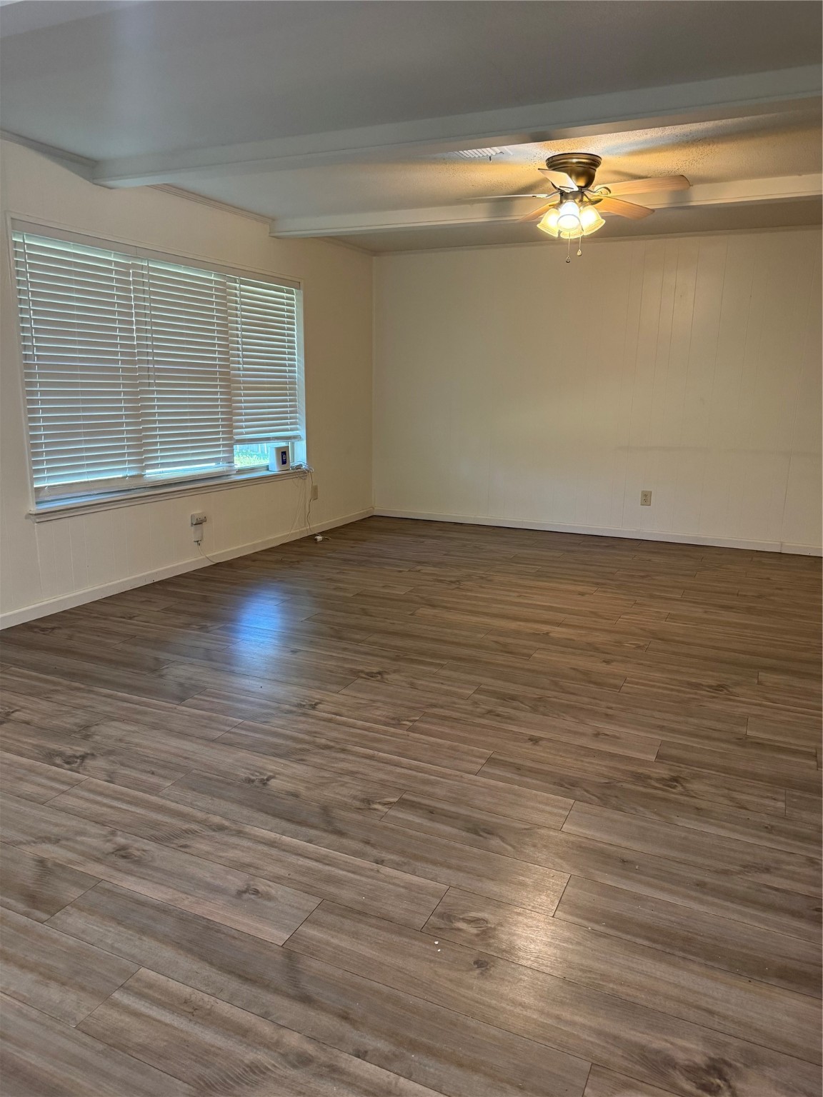 3210 Haydee Road Spring, TX 77388 - Photo 9 of 12 a view of an empty room with wooden floor and a window