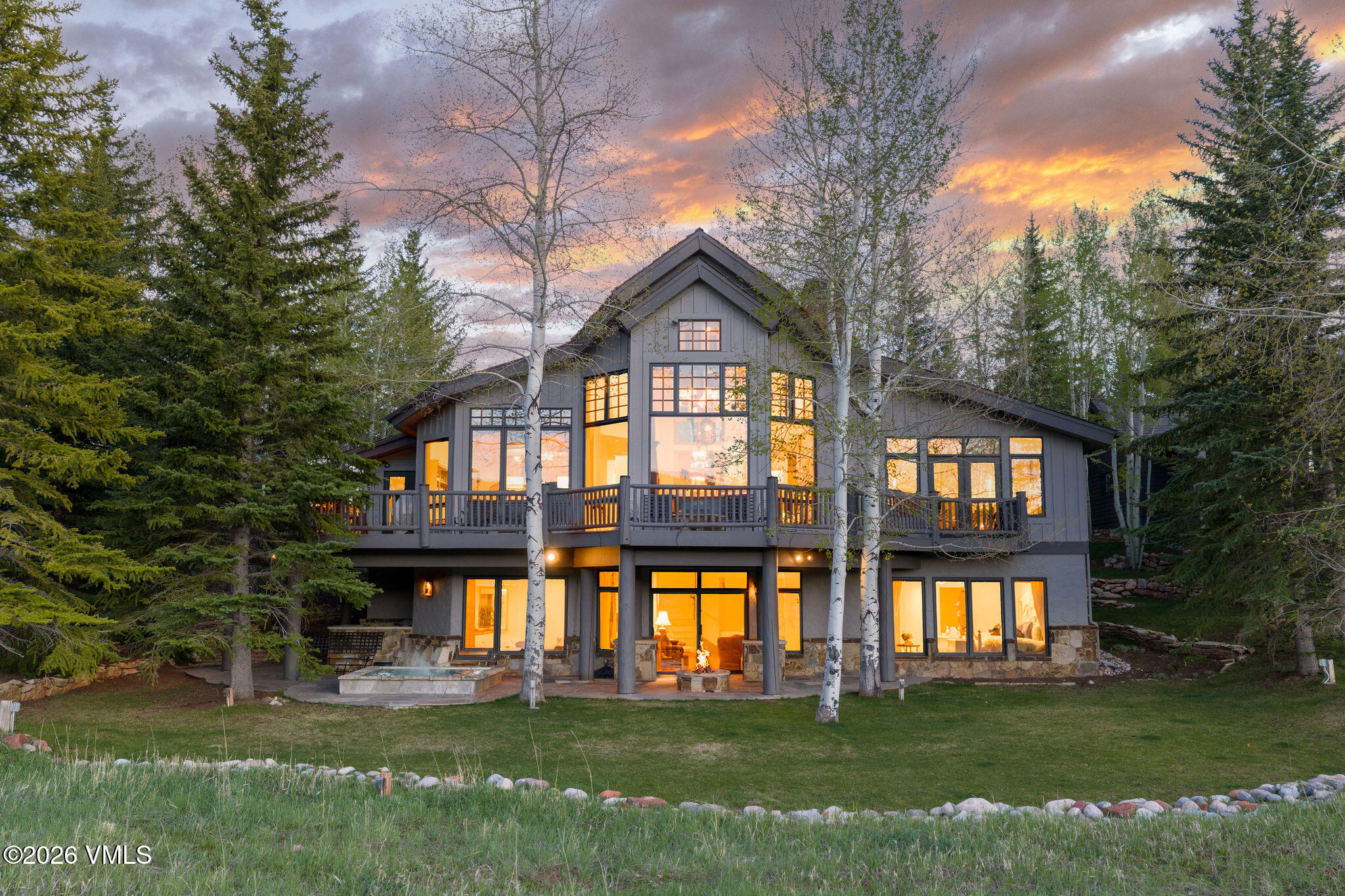 102 Saddle Ridge Loop Edwards, CO 81632 - Photo 1 of 29 a front view of a house with a garden