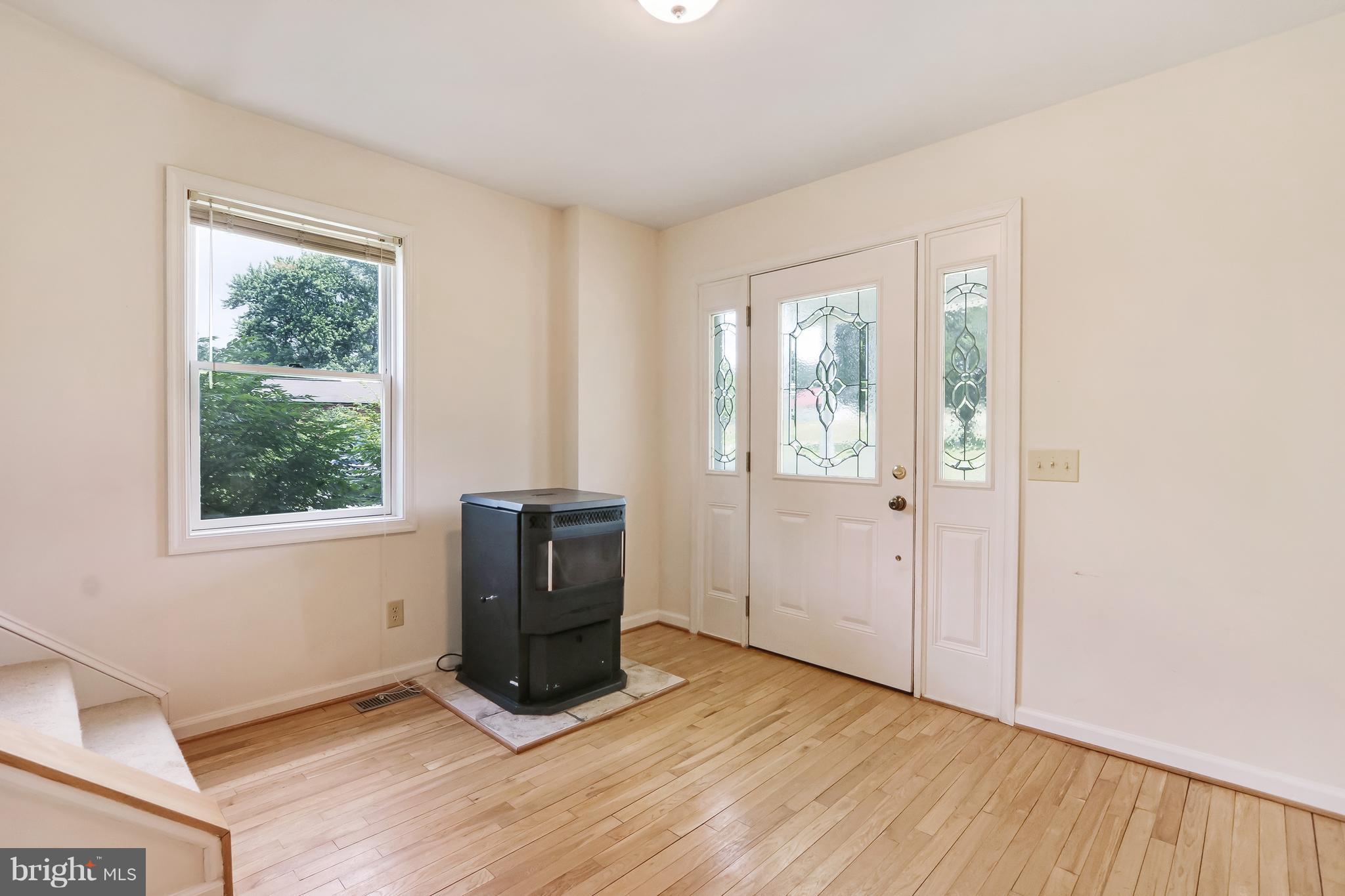 3102 Rices Lane Baltimore, MD 21244 - Photo 2 of 30 Foyer has pellet stove, wood floors