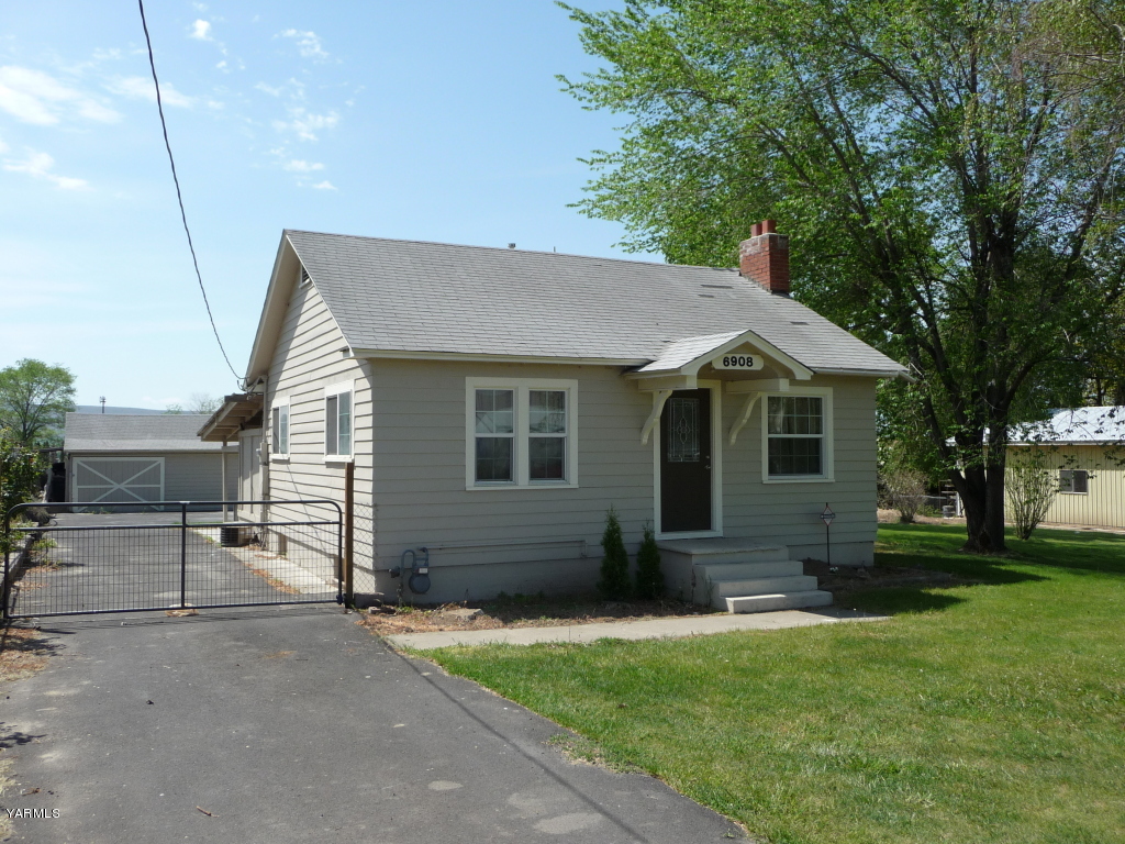 6908 Mieras Road Yakima, WA 98901 - Photo 3 of 4 a view of a house with a yard