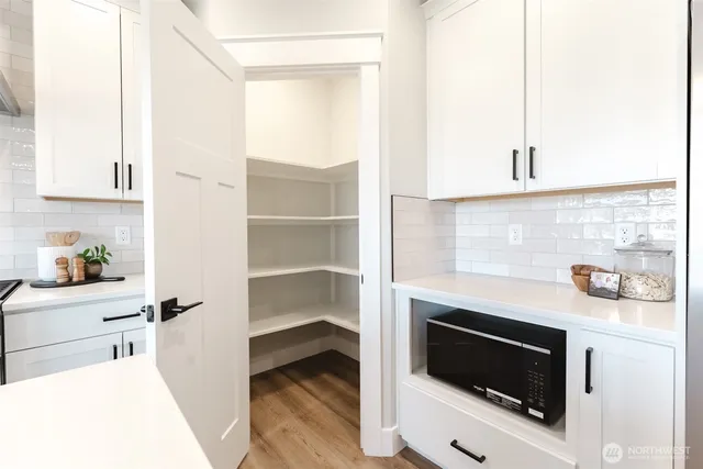 a kitchen with a stove and a microwave