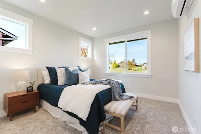 a bed room with a bed and a window