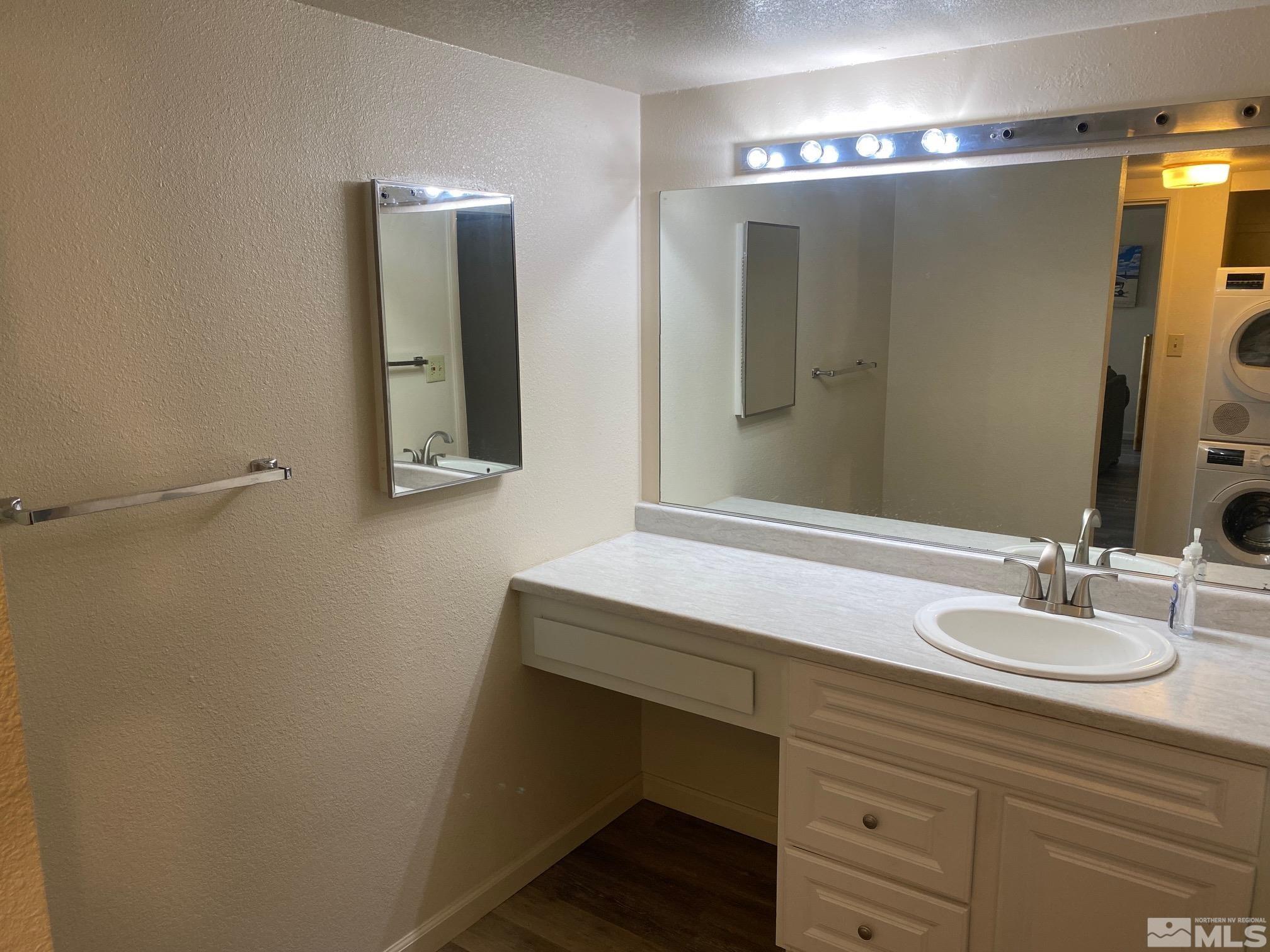 83 Vista Rafael Parkway, Unit 83 Reno, NV 89503 - Photo 11 of 16 a bathroom with a sink and a mirror