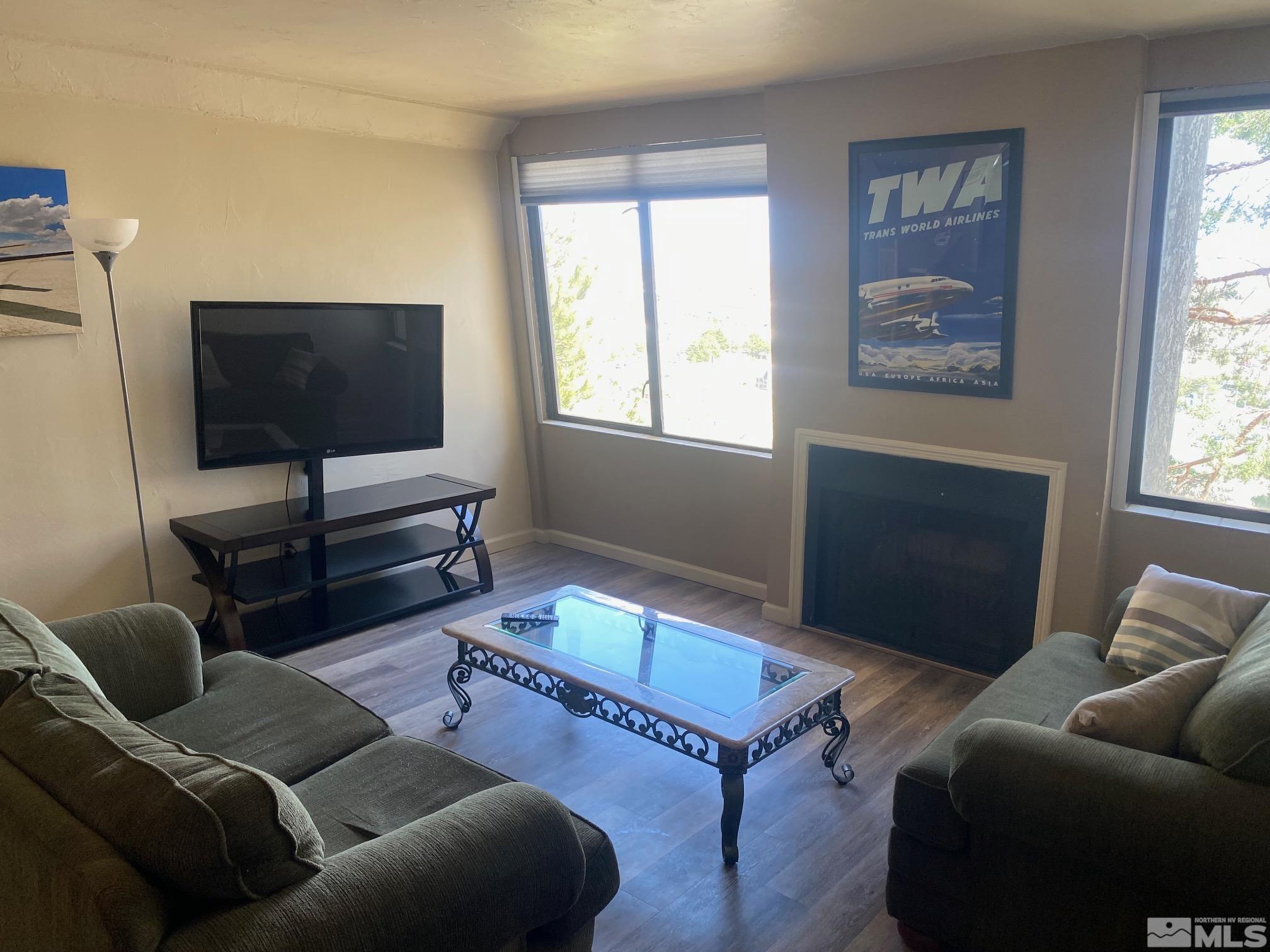 83 Vista Rafael Parkway, Unit 83 Reno, NV 89503 - Photo 3 of 16 a living room with furniture and a flat screen tv