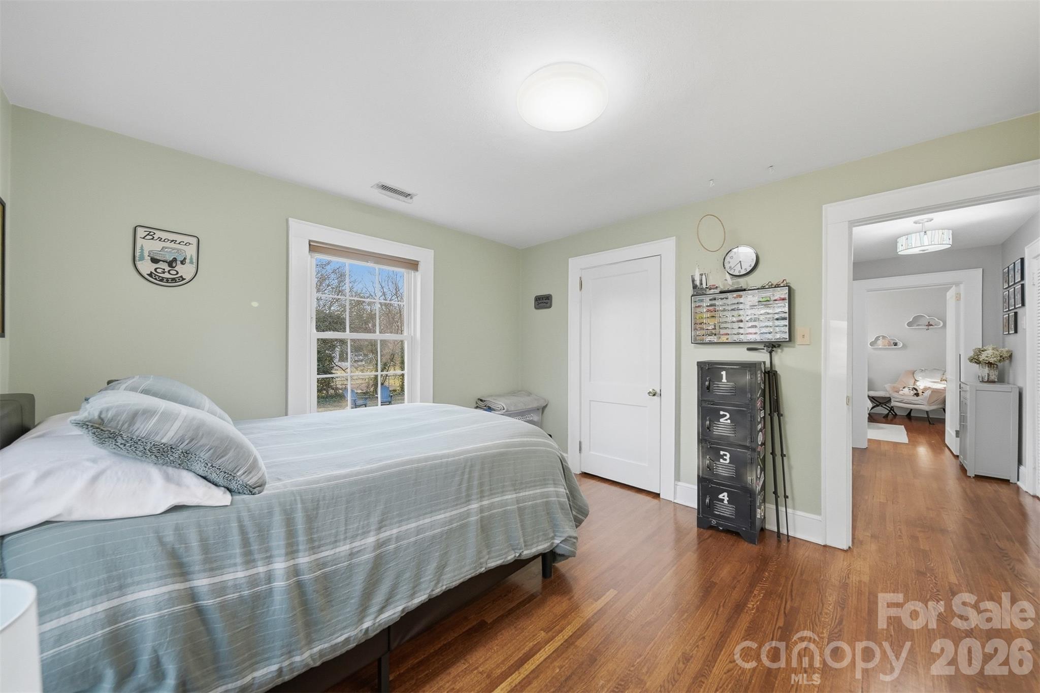 1519 3rd Street Northwest Hickory, NC 28601 - Photo 19 of 48 a bedroom with a bed and a window