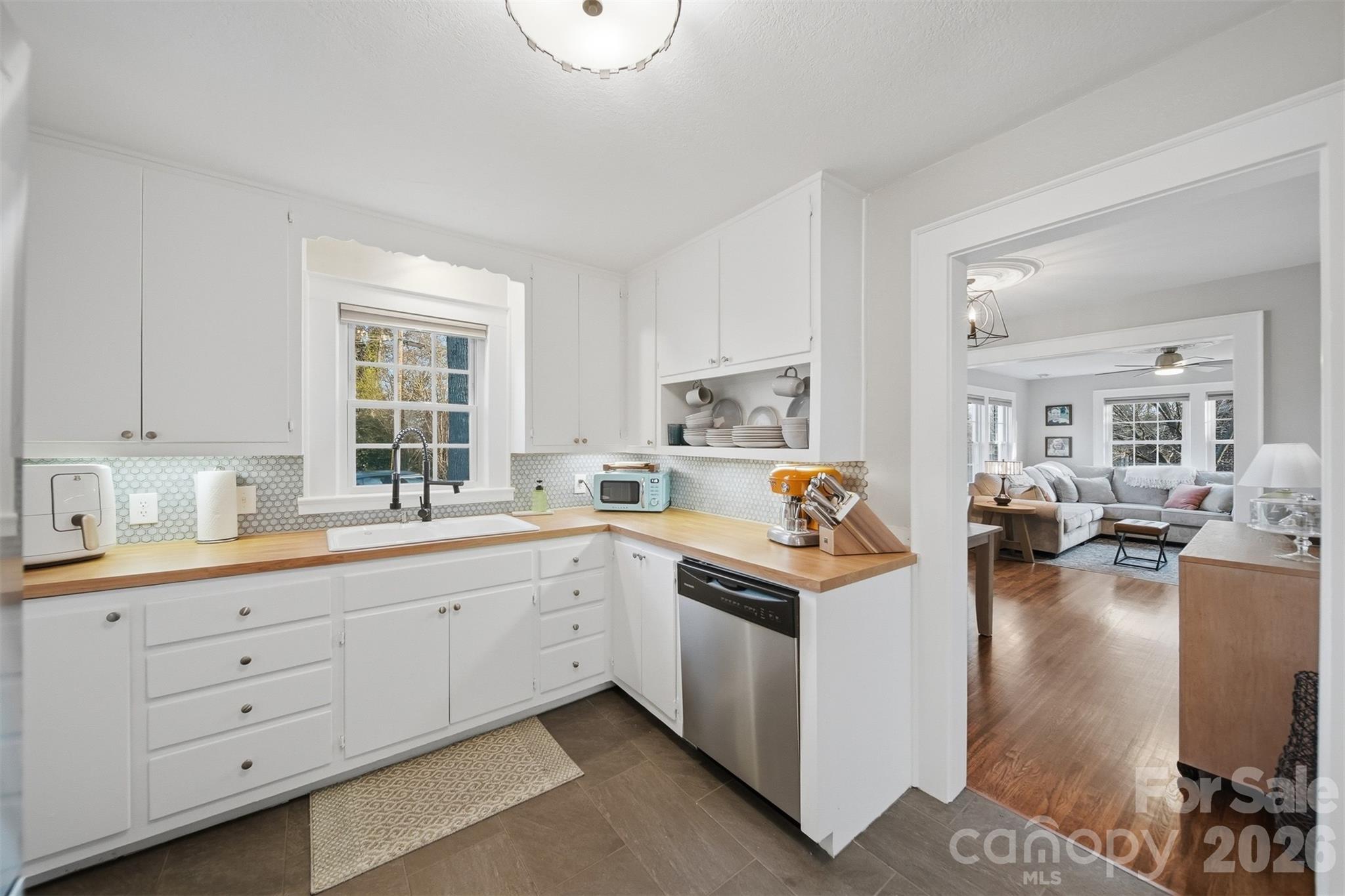 1519 3rd Street Northwest Hickory, NC 28601 - Photo 24 of 48 a view of a kitchen that has a lot of white cabinets and stainless steel appliances