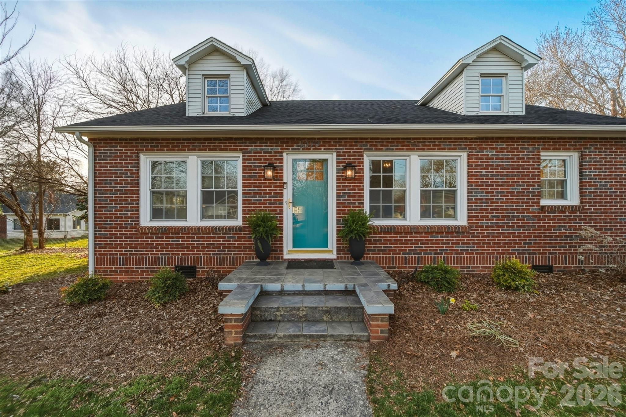 1519 3rd Street Northwest Hickory, NC 28601 - Photo 33 of 48 a front view of a house with garden