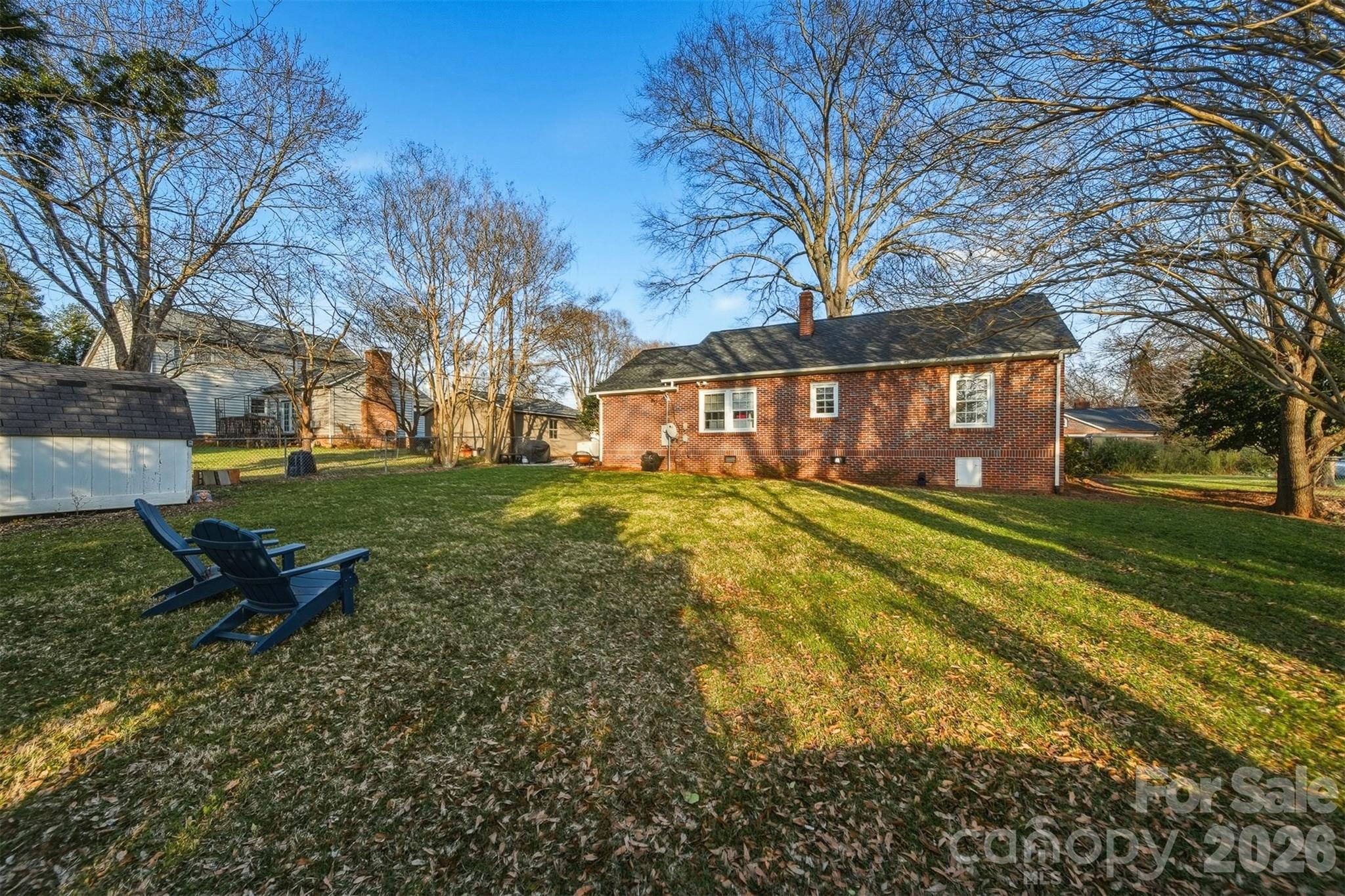 1519 3rd Street Northwest Hickory, NC 28601 - Photo 35 of 48 a view of a house with backyard and trees