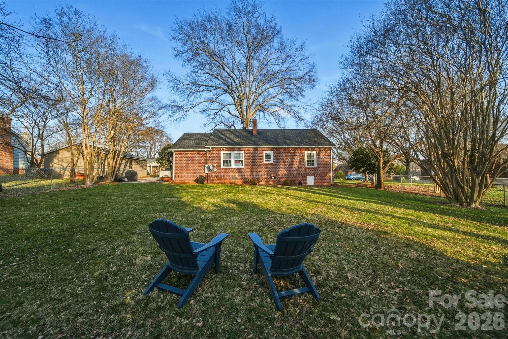 1519 3rd Street Northwest Hickory, NC 28601 - Photo 38 of 48 a view of a house with a yard table and chair