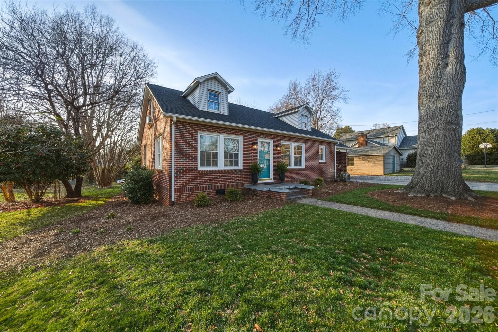 1519 3rd Street Northwest Hickory, NC 28601 - Photo 39 of 48 a front view of a house with a yard