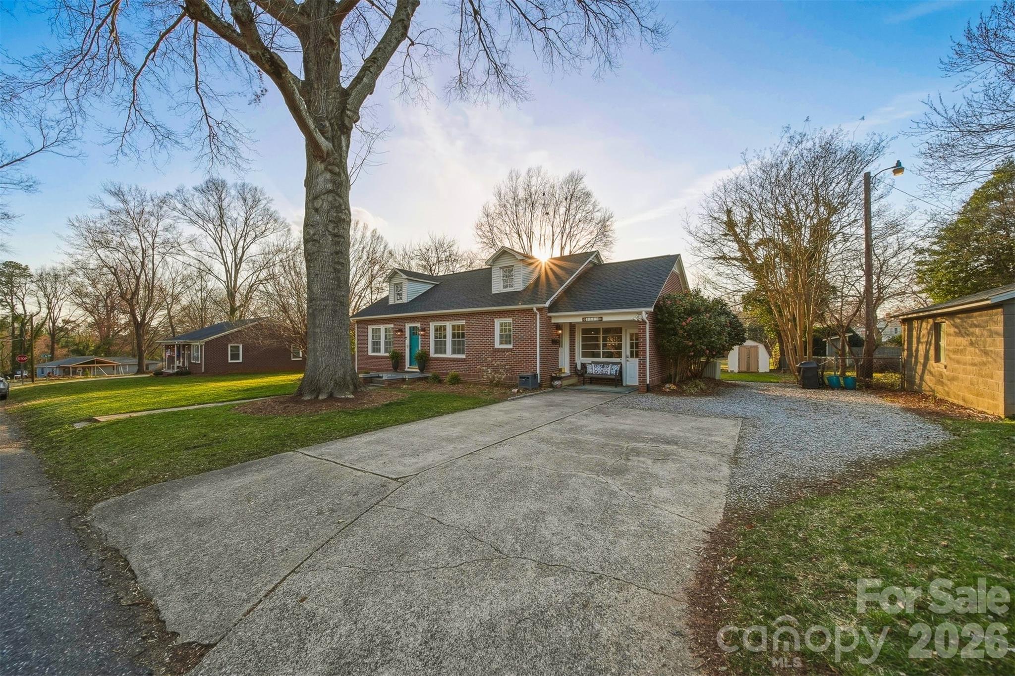 1519 3rd Street Northwest Hickory, NC 28601 - Photo 44 of 48 a view of a yard in front of a house with a large tree