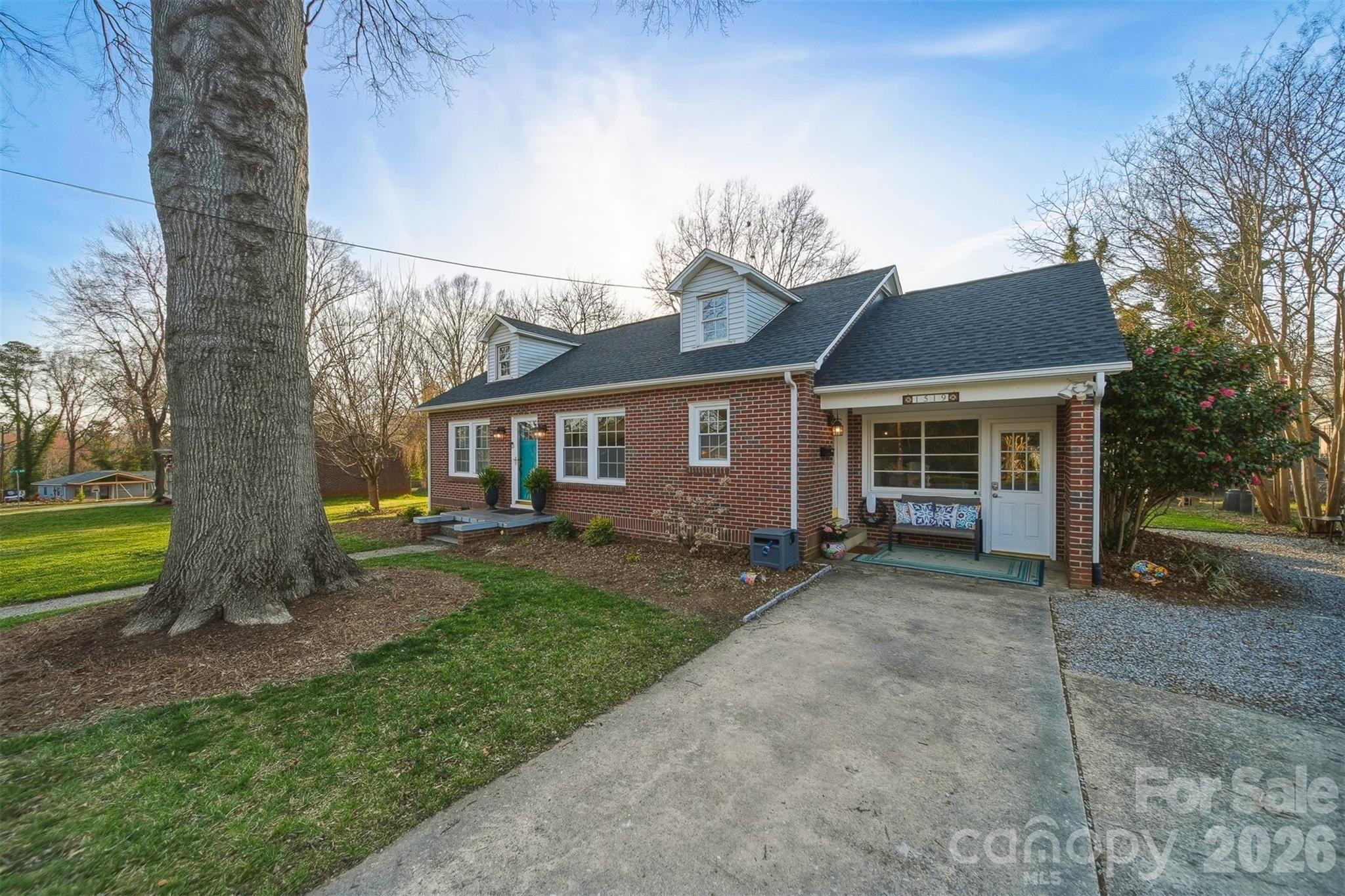 1519 3rd Street Northwest Hickory, NC 28601 - Photo 46 of 48 a front view of a house with a garden and yard