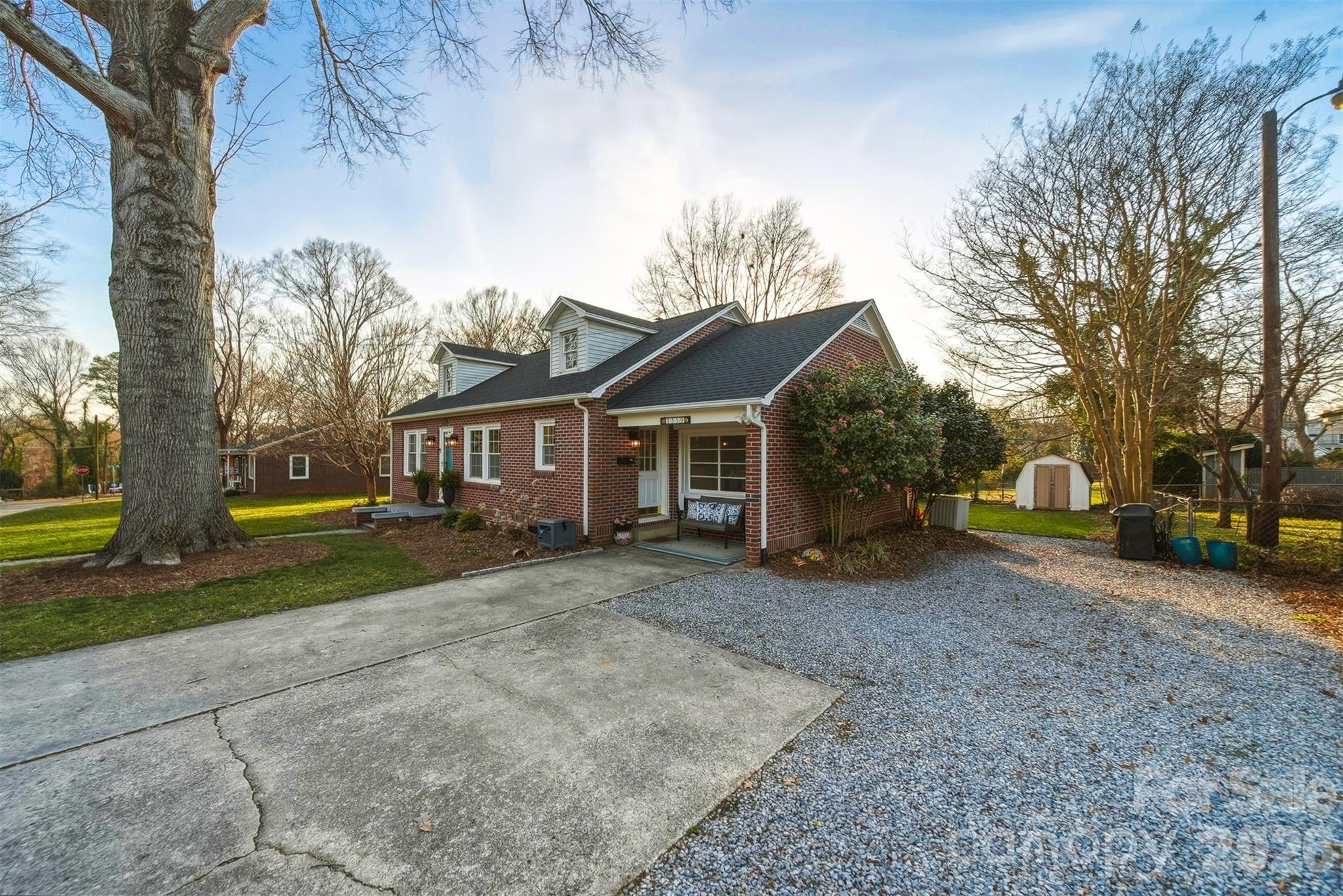 1519 3rd Street Northwest Hickory, NC 28601 - Photo 47 of 48 a view of a yard in front of a house with large trees