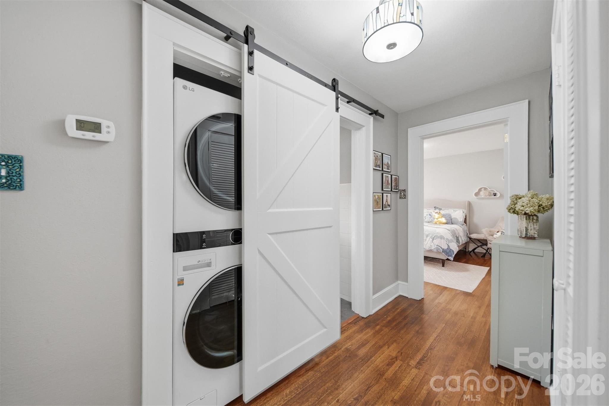 1519 3rd Street Northwest Hickory, NC 28601 - Photo 6 of 48 a view of a hallway with washer and dryer