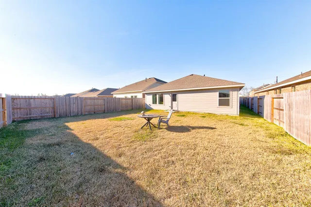 a house view with a backyard space
