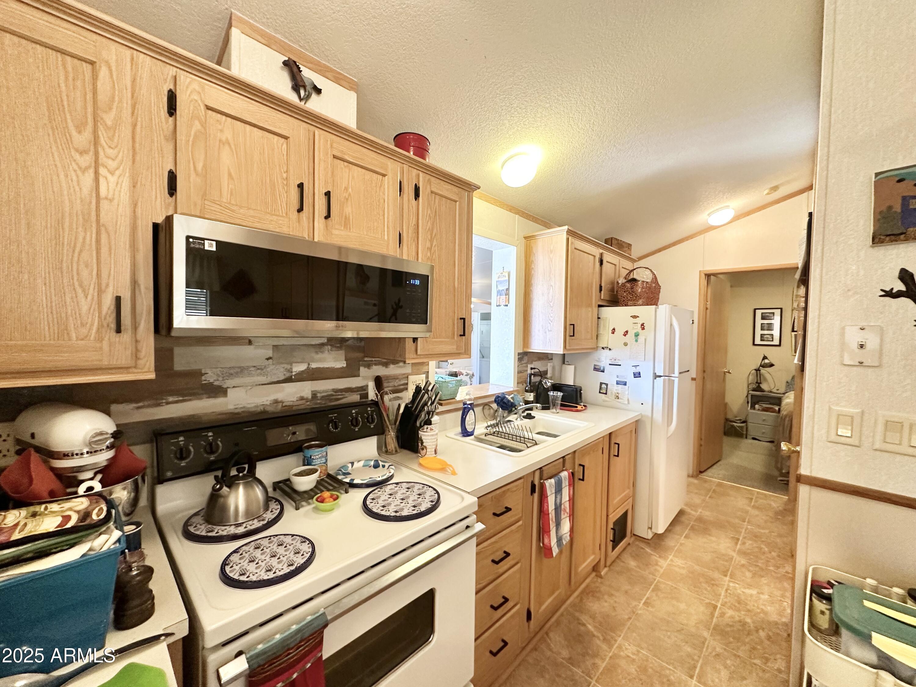 1027 South Prospectors Road Apache Junction, AZ 85119 - Photo 28 of 70 NEW MICROWAVE/FULL SIZE STOVE