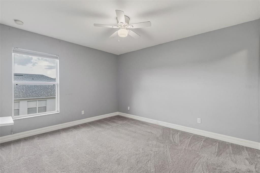 25134 Palisade Road Punta Gorda, FL 33983 - Photo 39 of 58 an empty room with a window and a ceiling fan