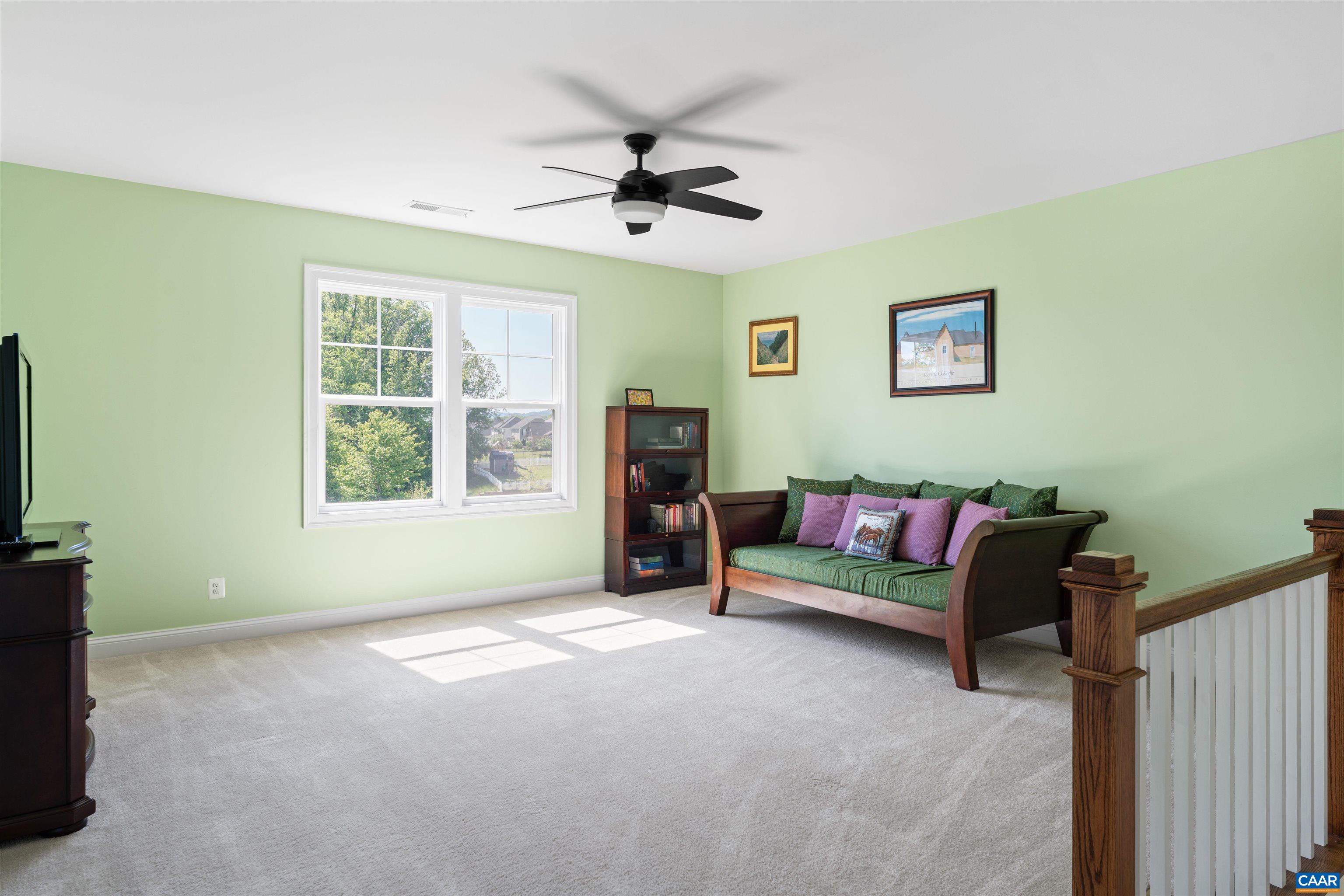 322 Claibourne Road Crozet, VA 22932 - Photo 18 of 25 a living room with furniture and a flat screen tv