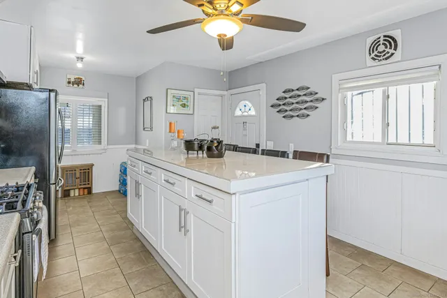 a bathroom with a sink a chandelier and a mirror