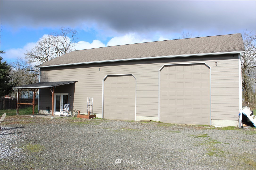 9239 Applegate Loop Southwest Rochester, WA 98579 - Photo 32 of 40 a view of a house with a garage