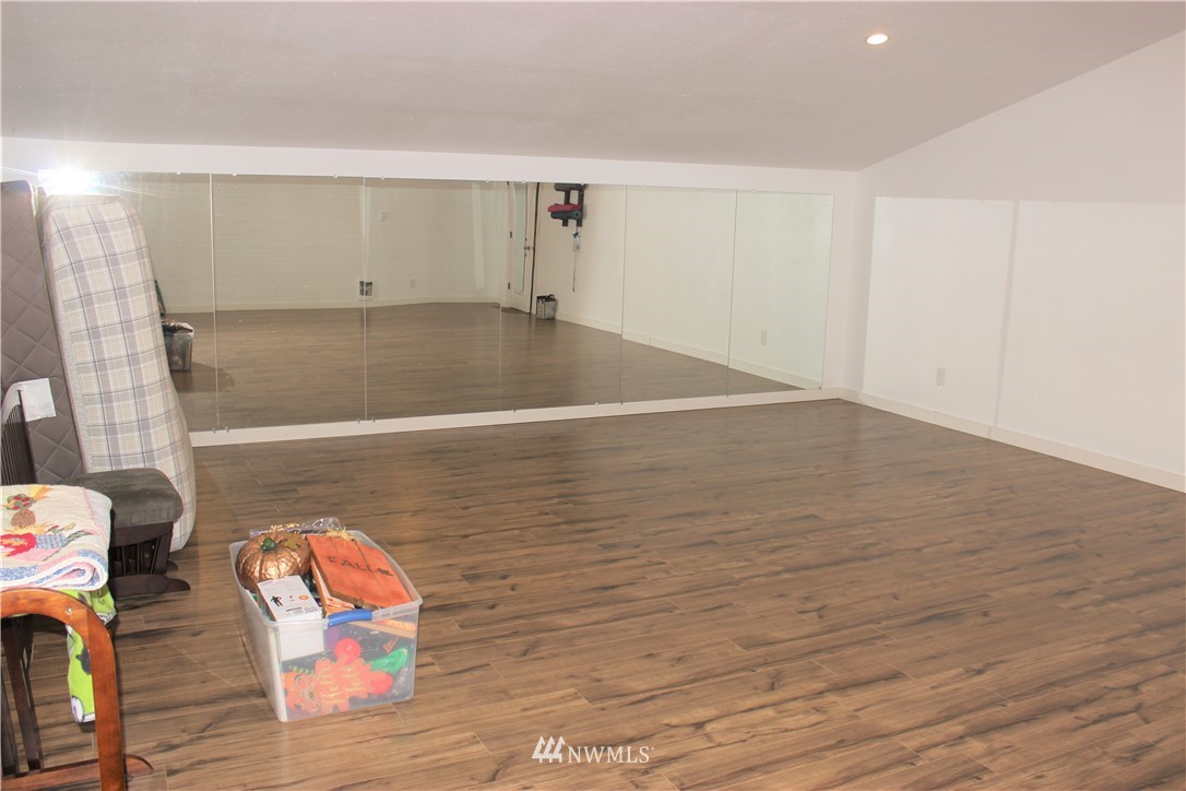 9239 Applegate Loop Southwest Rochester, WA 98579 - Photo 39 of 40 a view of wooden floor in a room