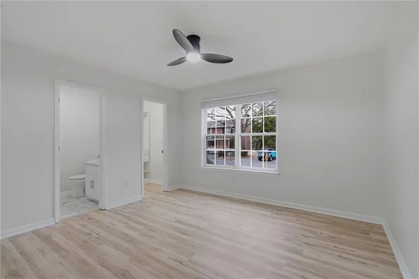 a view of an empty room with a window