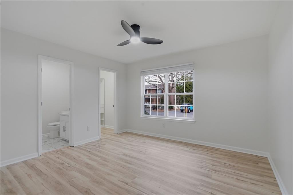 256 Quail Run, Unit 256 Roswell, GA 30076 - Photo 11 of 33 a view of an empty room with a window