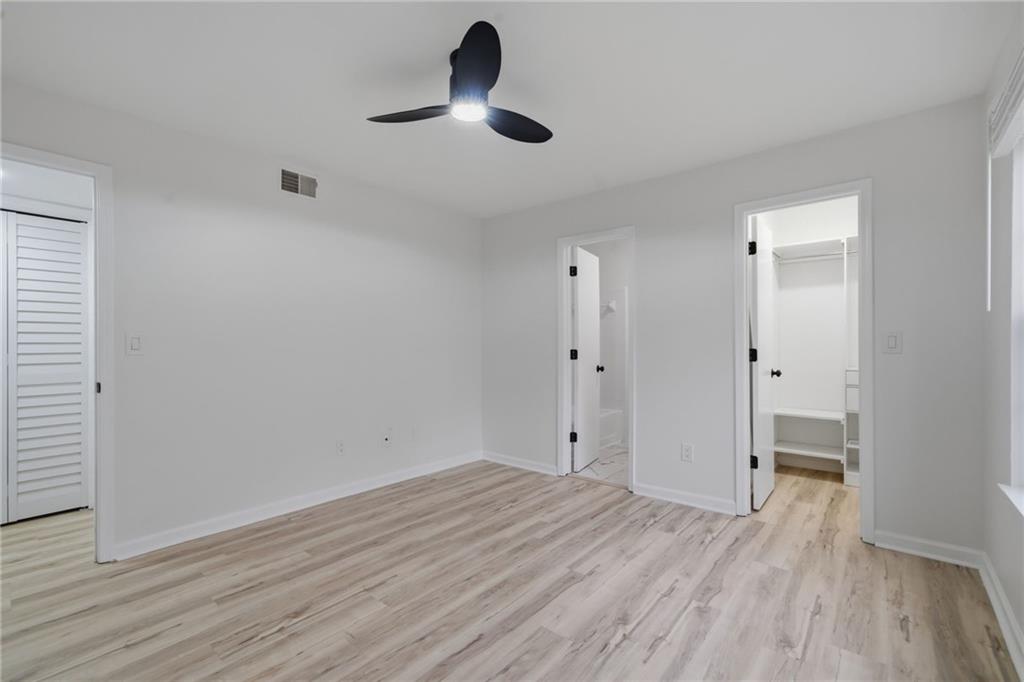 256 Quail Run, Unit 256 Roswell, GA 30076 - Photo 13 of 33 wooden floor in an empty room