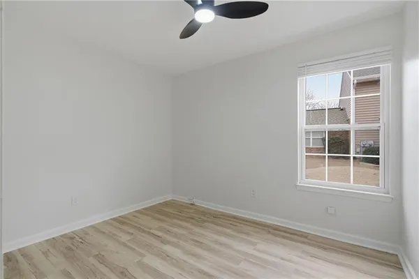 a view of empty room with windows