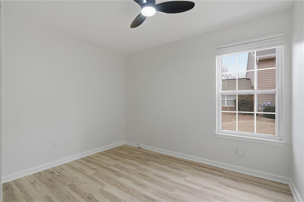 256 Quail Run, Unit 256 Roswell, GA 30076 - Photo 15 of 33 a view of empty room with windows