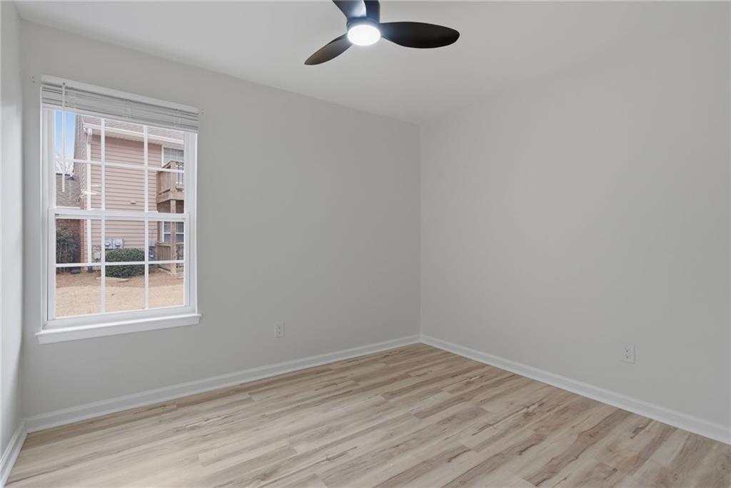 256 Quail Run, Unit 256 Roswell, GA 30076 - Photo 17 of 33 an empty room with a window