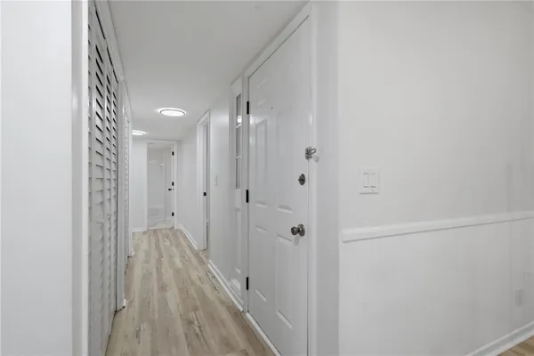 a view of a bathroom from the hallway