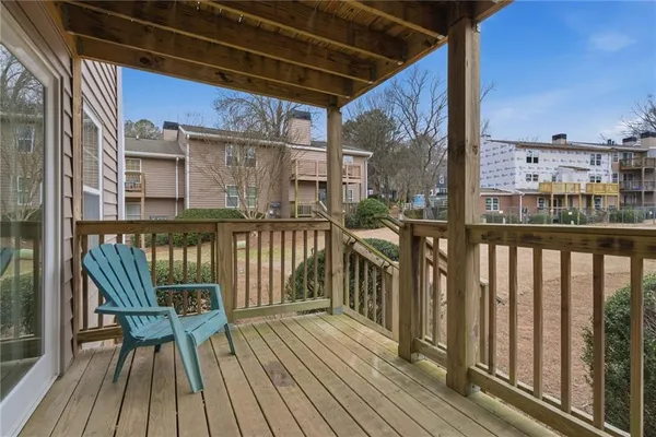 a view of a balcony with wooden floor
