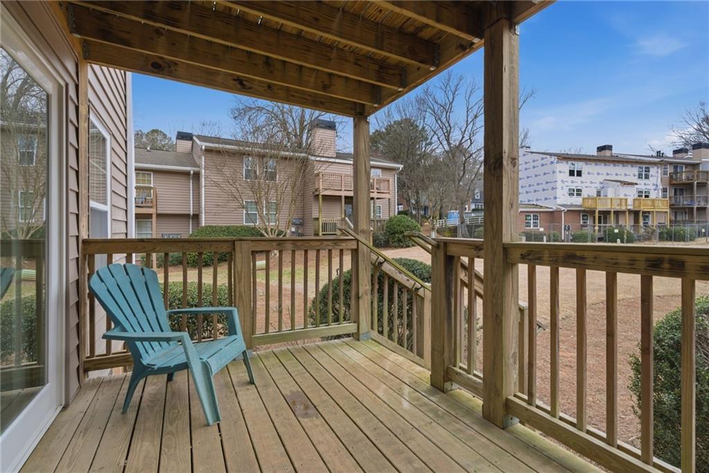 256 Quail Run, Unit 256 Roswell, GA 30076 - Photo 23 of 33 a view of a balcony with wooden floor
