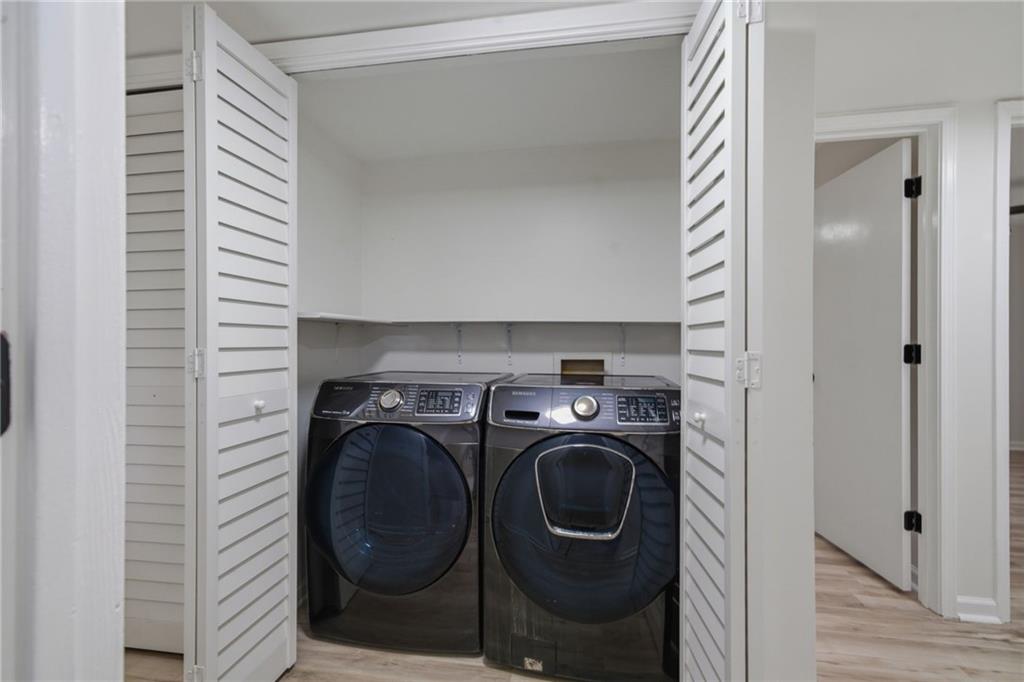 256 Quail Run, Unit 256 Roswell, GA 30076 - Photo 25 of 33 a utility room with dryer and washer